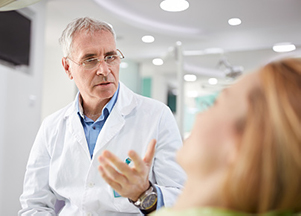 Image of a dental professional discussing veneers vs dental crowns, at Myers Park Dental Partners in Charlotte, NC.