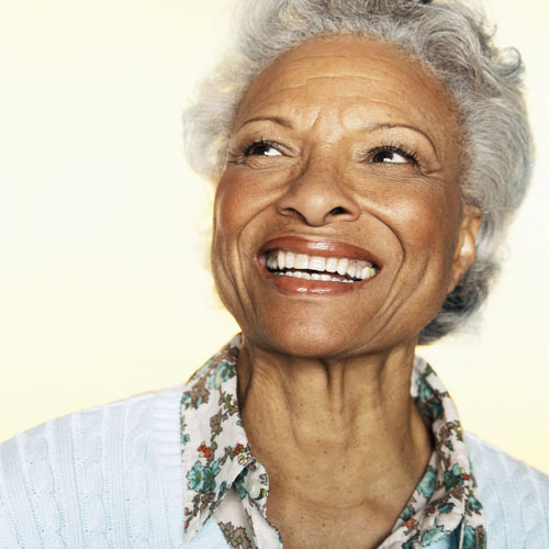 A person smiling after recovering from the dental implant treatment process, at Myers Park Dental Partners in Charlotte, NC.
