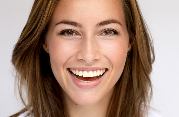 Beautiful woman smiling after getting cosmetic dental treatment at Myers Park Dental Partners in Charlotte, NC